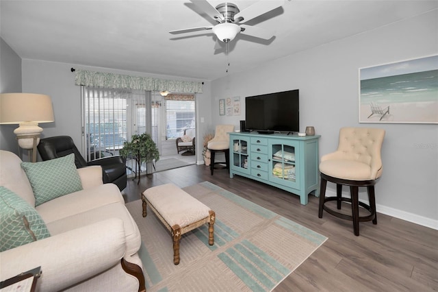 living room featuring hardwood / wood-style flooring and ceiling fan