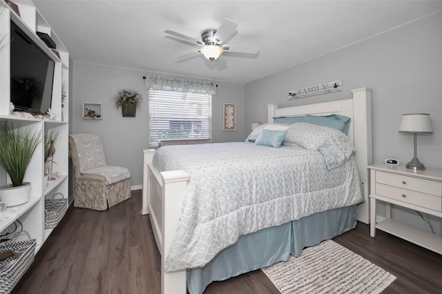 bedroom with ceiling fan and dark hardwood / wood-style flooring