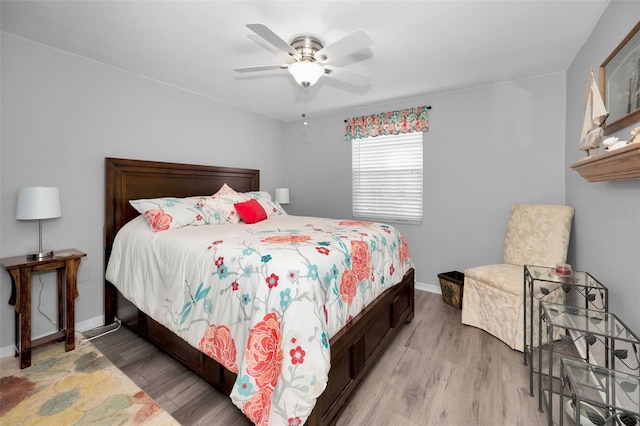 bedroom featuring ceiling fan and light hardwood / wood-style floors