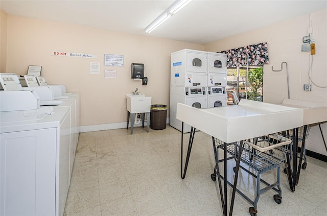 laundry area featuring washer and dryer and stacked washer / drying machine