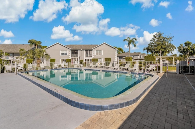 view of swimming pool with a patio area