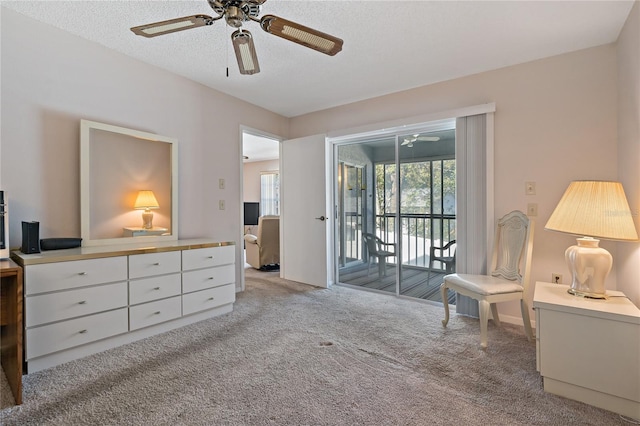 sitting room featuring light carpet and a textured ceiling