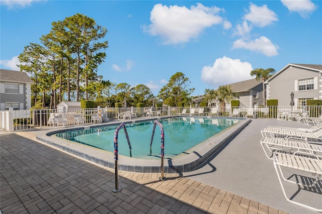 view of swimming pool with a patio