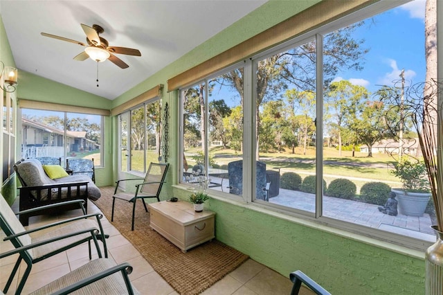 sunroom featuring ceiling fan and lofted ceiling