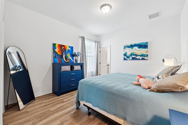 bedroom featuring light hardwood / wood-style flooring