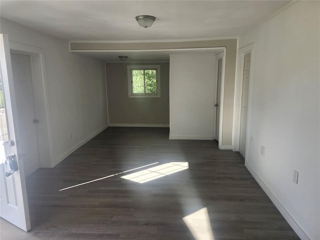 empty room featuring dark wood-type flooring