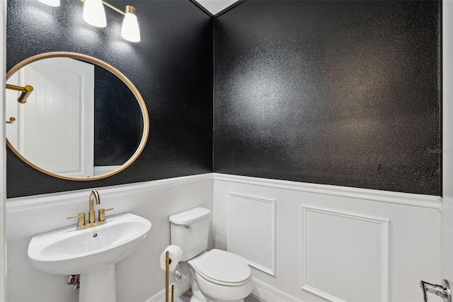 bathroom with sink and toilet