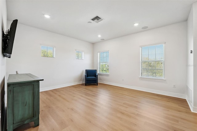 unfurnished room featuring light hardwood / wood-style floors