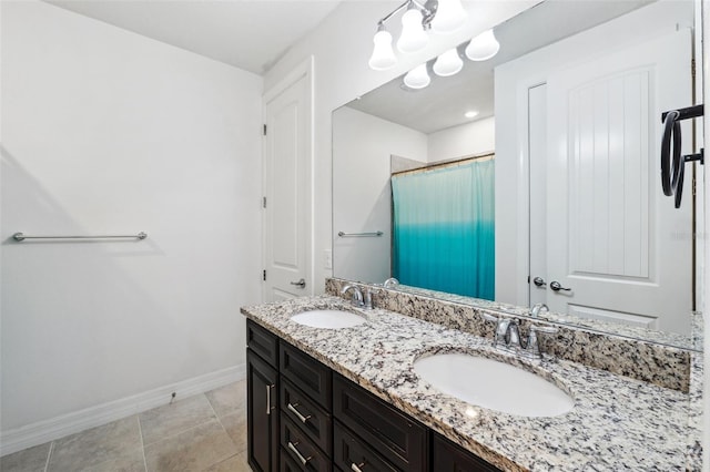 bathroom featuring a chandelier, vanity, tile patterned floors, and curtained shower