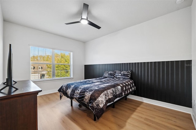 bedroom featuring ceiling fan and wood-type flooring