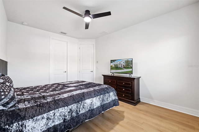 bedroom featuring ceiling fan and light hardwood / wood-style flooring