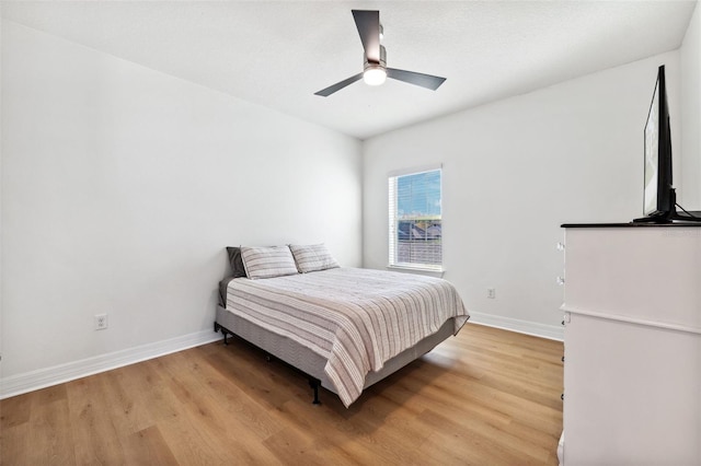 bedroom featuring ceiling fan and light wood-type flooring