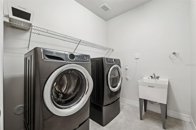 laundry room featuring washer and dryer