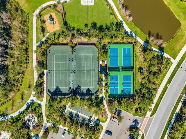 birds eye view of property with a water view