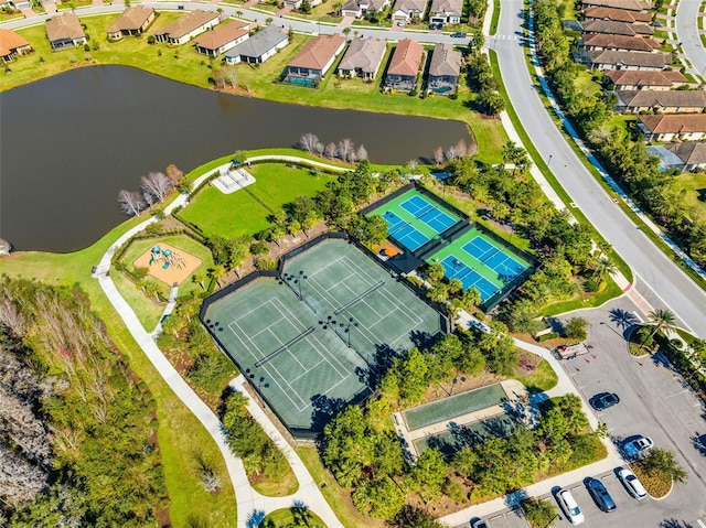 birds eye view of property with a water view