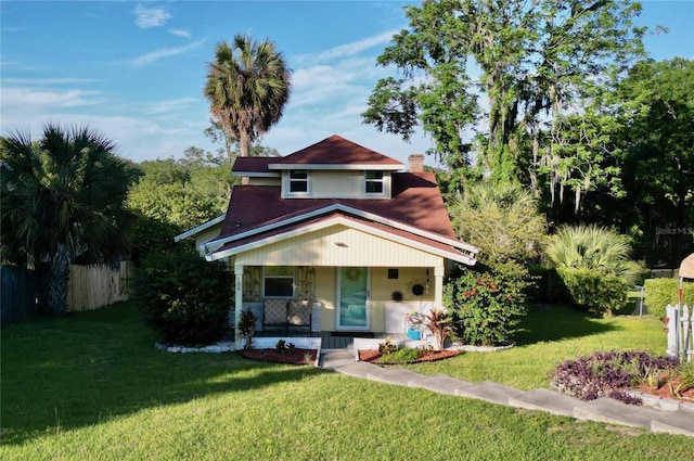 view of front facade with a porch and a front lawn