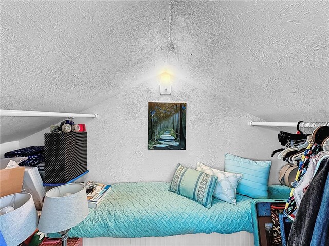 bedroom with vaulted ceiling