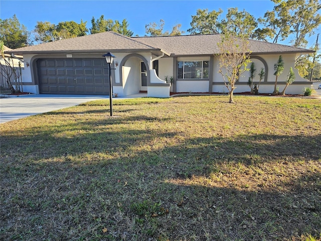 single story home with a front yard and a garage