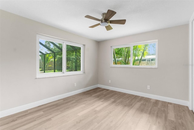 unfurnished room featuring light hardwood / wood-style flooring and ceiling fan