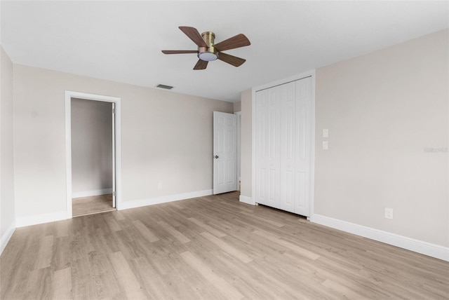 unfurnished bedroom with light wood-type flooring and ceiling fan