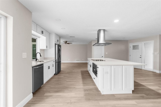 kitchen featuring refrigerator, dishwasher, a center island, white cabinetry, and range hood