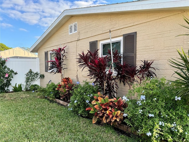 view of home's exterior featuring a yard