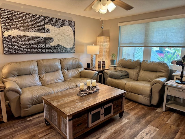 living room featuring ceiling fan and dark hardwood / wood-style flooring