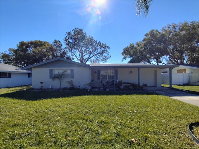 ranch-style home with a garage and a front lawn