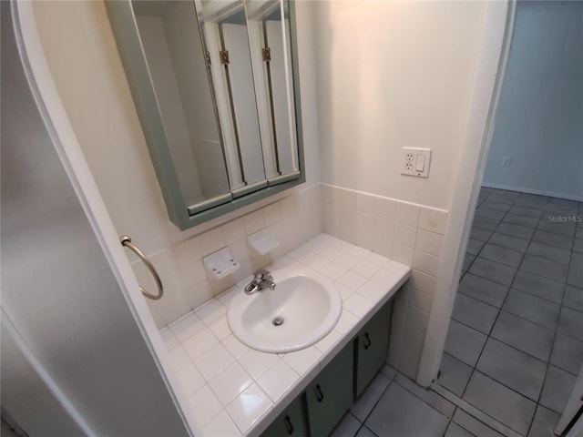 bathroom with tile patterned floors and vanity