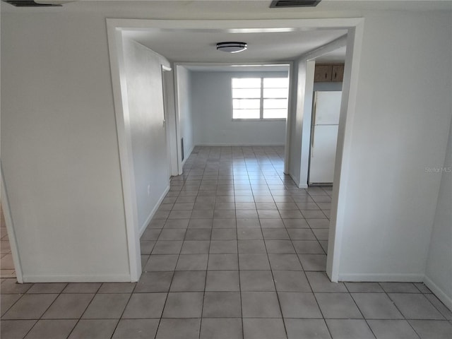 hallway with light tile patterned flooring