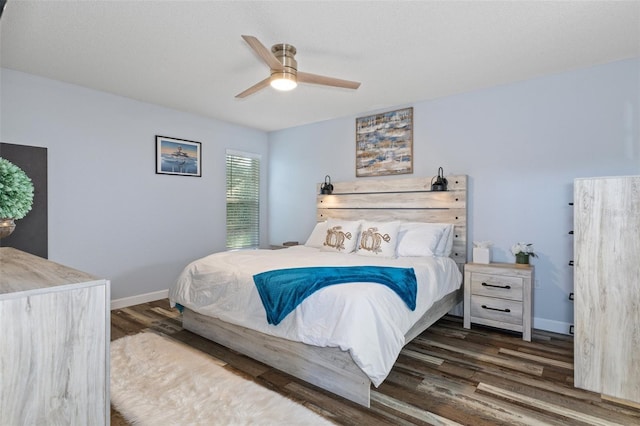 bedroom featuring dark hardwood / wood-style floors and ceiling fan