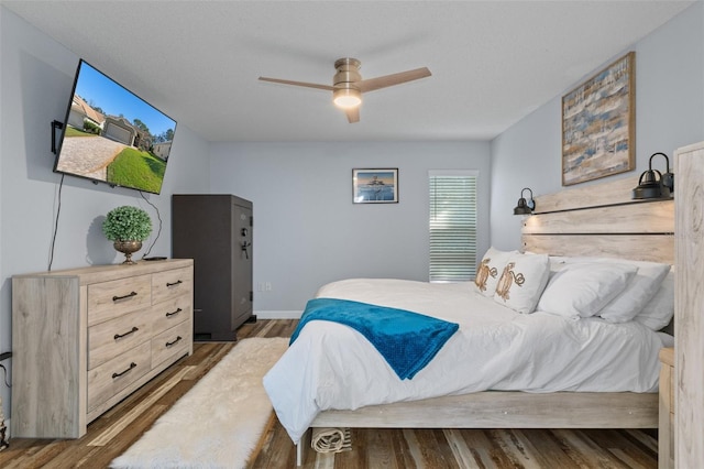 bedroom featuring hardwood / wood-style flooring and ceiling fan