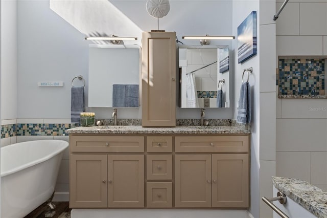 bathroom with shower with separate bathtub, vanity, and tile walls