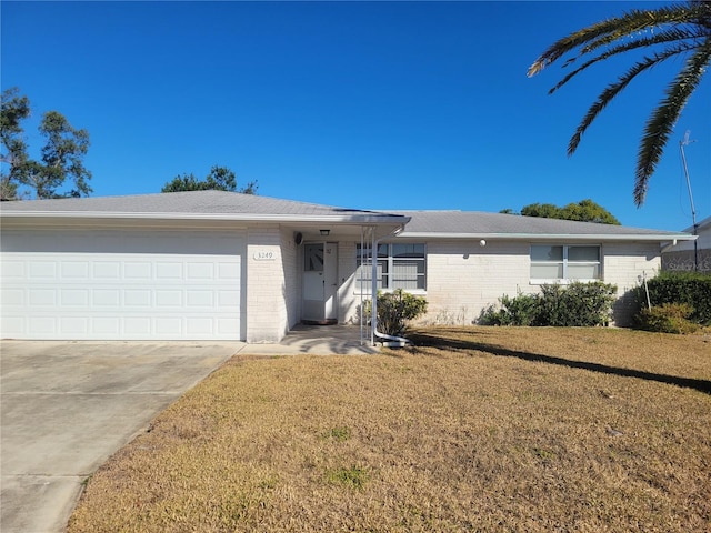 3249 Trask Dr, Holiday, FL 34691 - ranch-style home with a garage and a front lawn