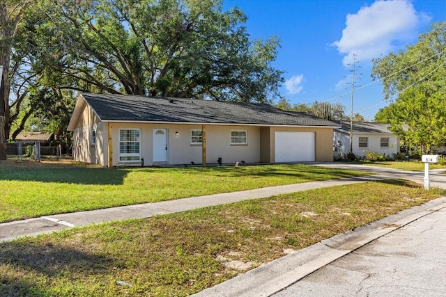 ranch-style home featuring a garage and a front yard