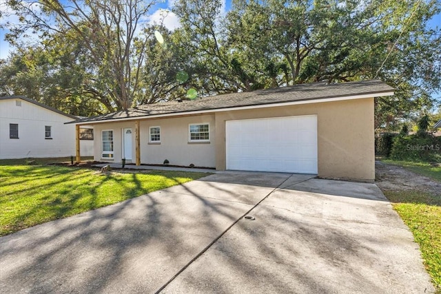 ranch-style home featuring a front yard and a garage