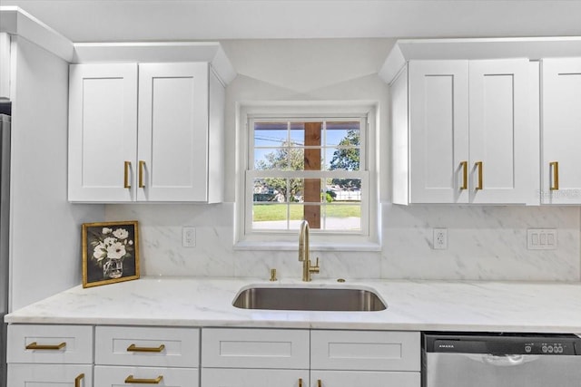 kitchen with white cabinetry, dishwasher, and sink