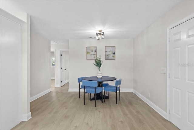 dining space featuring light hardwood / wood-style flooring