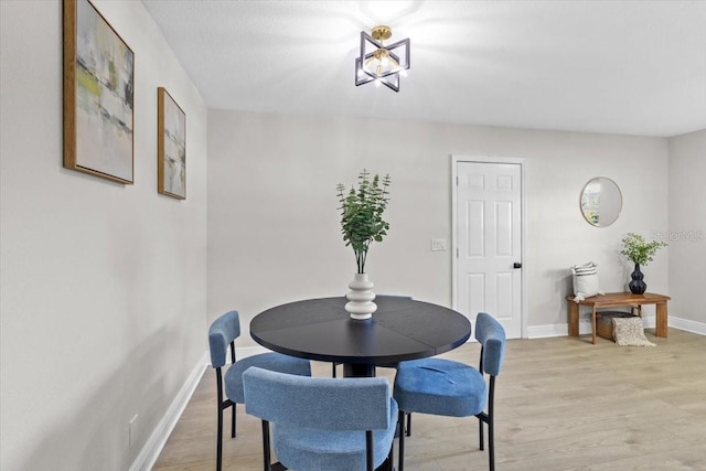 dining area with light wood-type flooring