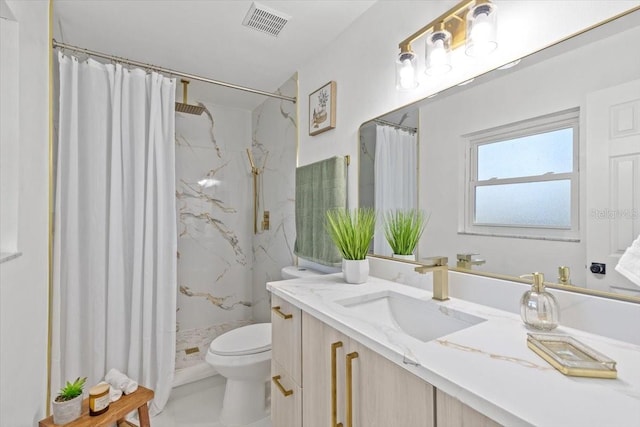 bathroom featuring curtained shower, vanity, and toilet