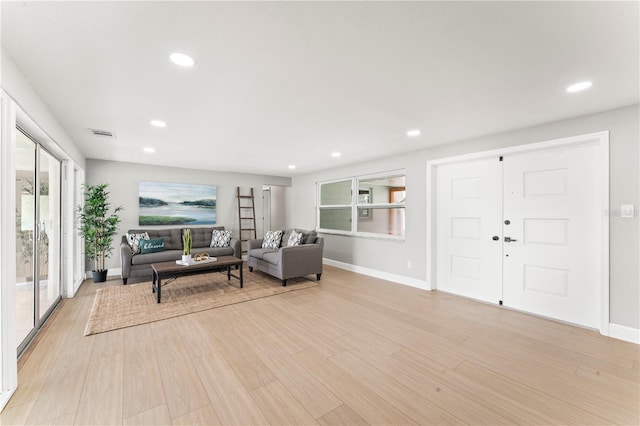 living room with light hardwood / wood-style flooring