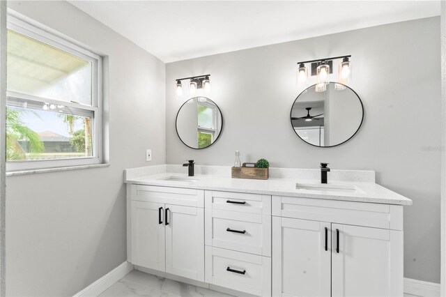 bathroom with ceiling fan and vanity