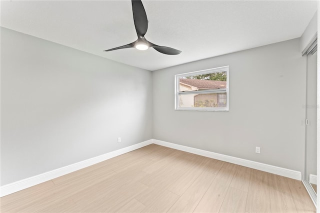 empty room with ceiling fan and wood-type flooring