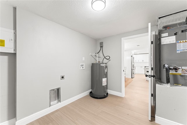 utility room with electric water heater