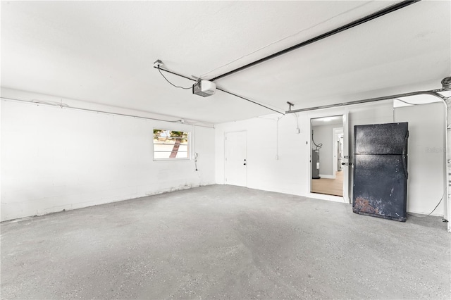 garage featuring electric panel and a garage door opener