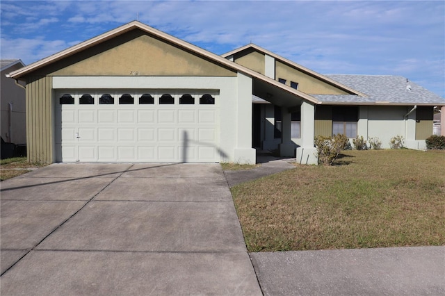 ranch-style house with a front lawn and a garage