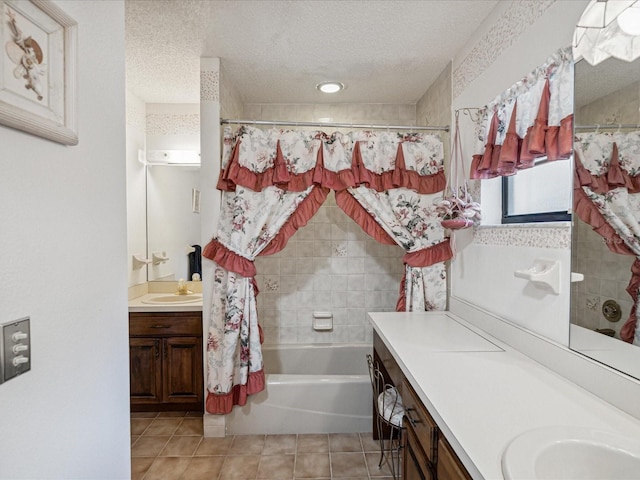 bathroom featuring tile patterned flooring, vanity, a textured ceiling, and shower / tub combo with curtain