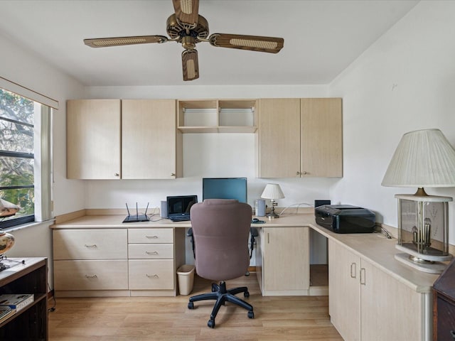 office space featuring ceiling fan and light hardwood / wood-style floors