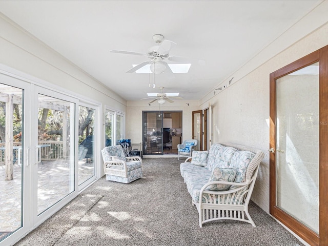 sunroom / solarium featuring a skylight and ceiling fan