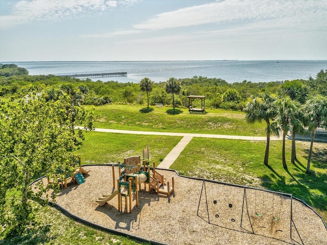 exterior space with a lawn and a water view